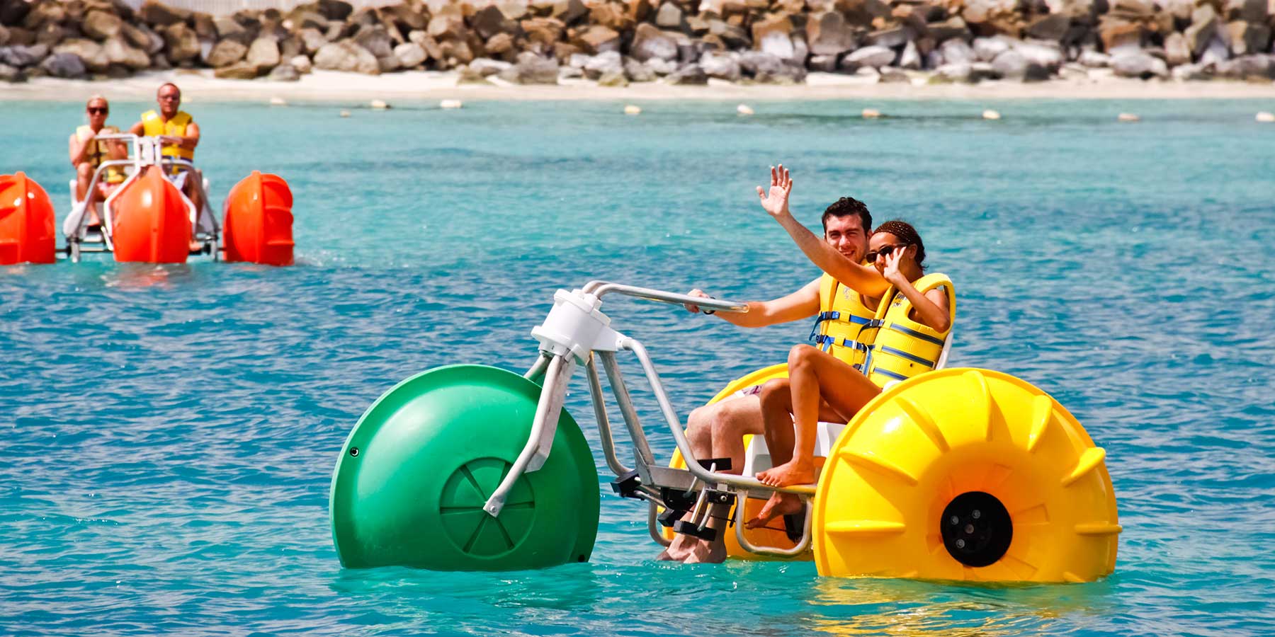 Aqua-Cycle™ Water Trikes in the ocean at an island or beach resort